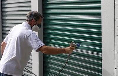 painting a roll-up self-storage door with airless sprayer