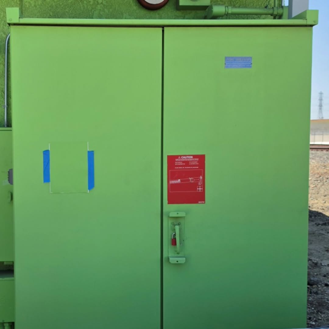 Green utility-box doors after four years of outdoor exposure at a Southern California self-storage facility.